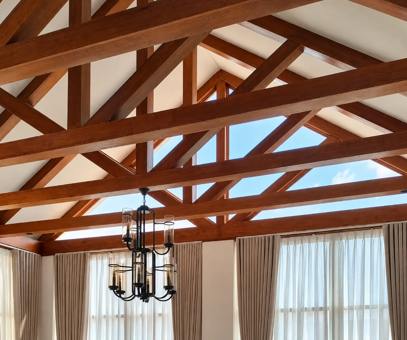 Curtains under a timber-beamed ceiling