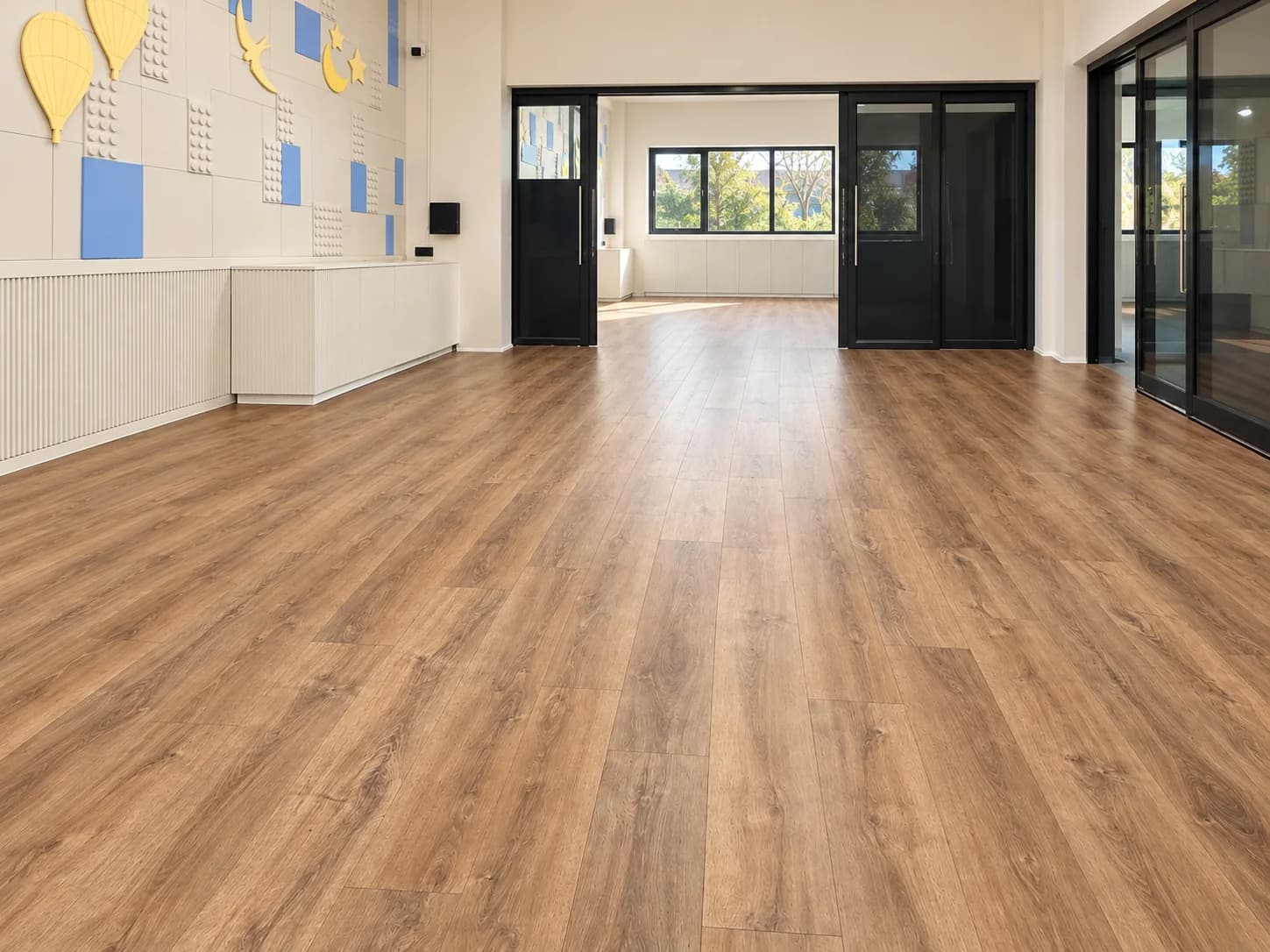 Wood-look flooring running the length of a room