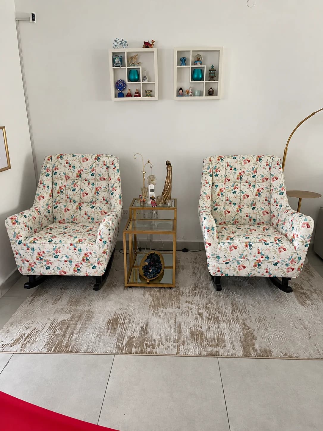 A pair of floral armchairs