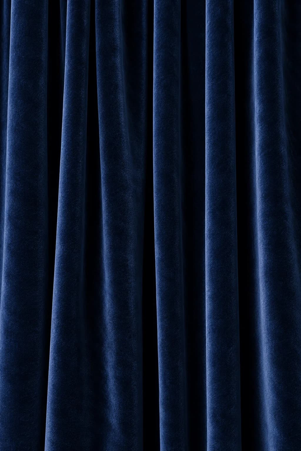 Deep navy velvet falling in soft folds